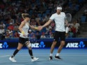 Germany's Alexander Zverev and Laura Siegemund react during their mixed doubles final match against Poland's Iga Swiatek and Hubert Hurkacz on January 7, 2024