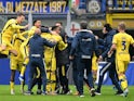 Hellas Verona's Thomas Henry celebrates scoring their first goal with teammates on January 6, 2024