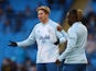 Manchester City's Kevin De Bruyne with Jeremy Doku during the warm up before the match on January 7, 2024