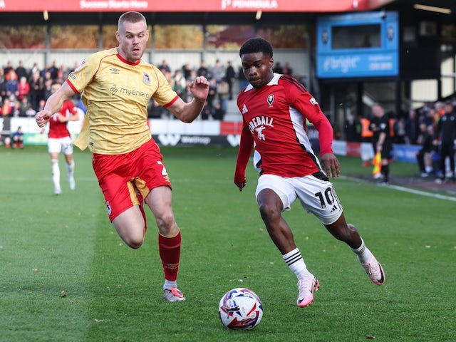 Salford City's Kelly Nmai (right) and Grimsby Town's Lewis Cass (left) on October 12, 2024