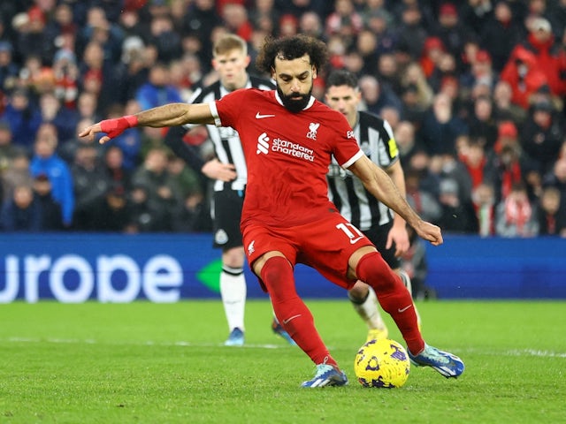 Liverpool's Mohamed Salah scores their fourth goal from the penalty spot on January 1, 2024
