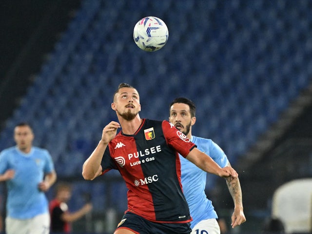 Genoa's Radu Dragusin in action with Lazio's Luis Alberto on August 27, 2023