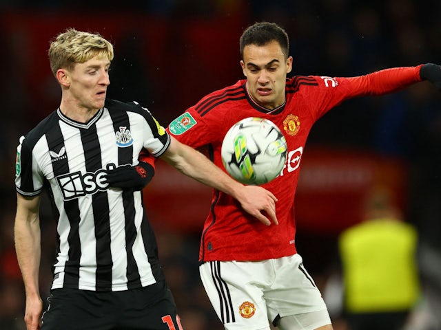 Manchester United's Sergio Reguilon in action with Newcastle United's Anthony Gordon on November 1, 2023