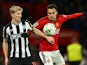 Manchester United's Sergio Reguilon in action with Newcastle United's Anthony Gordon on November 1, 2023