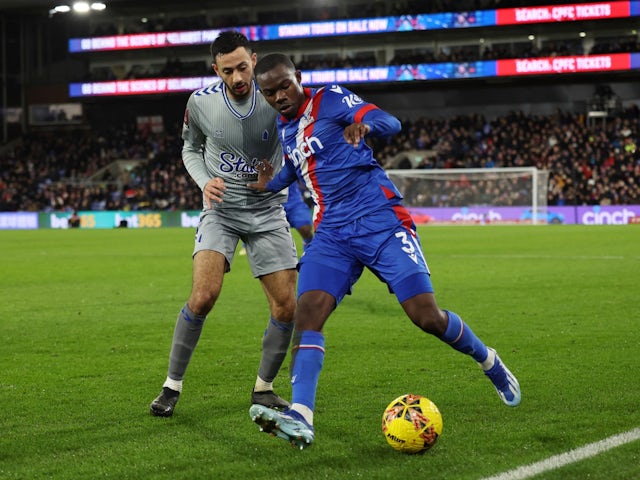 Crystal Palace's Tyrick Mitchell in action with Everton's Dwight McNeil on January 4, 2024