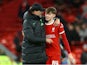 Liverpool manager Jurgen Klopp and Conor Bradley celebrate after the match on January 10, 2024