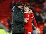 Liverpool manager Jurgen Klopp and Conor Bradley celebrate after the match on January 10, 2024