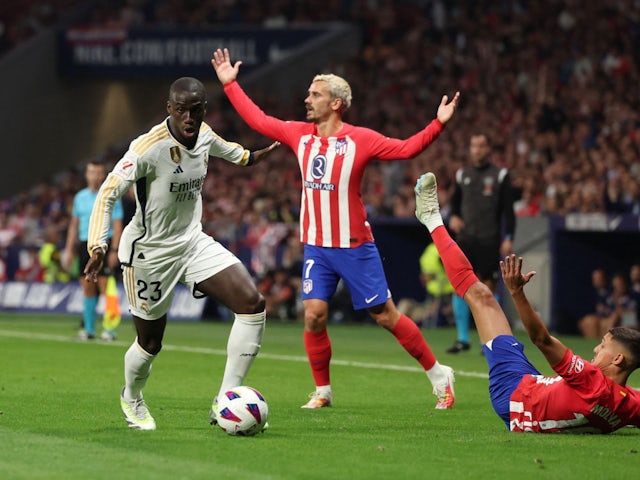 Real Madrid's Ferland Mendy in action with Atletico Madrid's Nahuel Molina on September 24, 2023