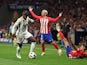 Real Madrid's Ferland Mendy in action with Atletico Madrid's Nahuel Molina on September 24, 2023