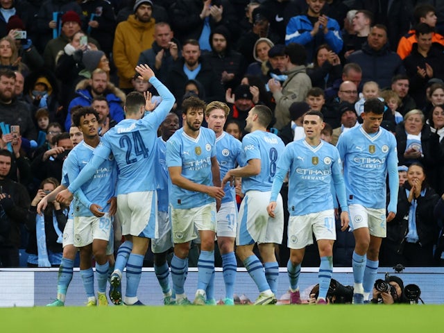 Manchester City players celebrate scoring their fifth goal on January 7, 2024