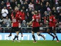 Manchester United Women's Rachel Williams celebrates scoring their fourth goal with Irene Guerrero, Leah Galton and Melvine Malard on January 14, 2024