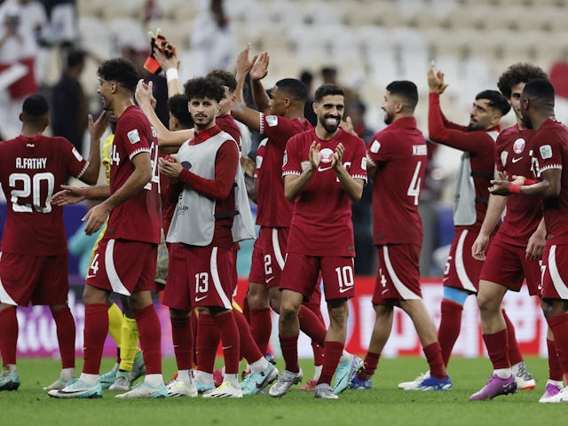 Qatar's Hassan Al-Haydos and teammates celebrate after the match on January 12, 2024
