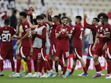 Qatar's Hassan Al-Haydos and teammates celebrate after the match on January 12, 2024