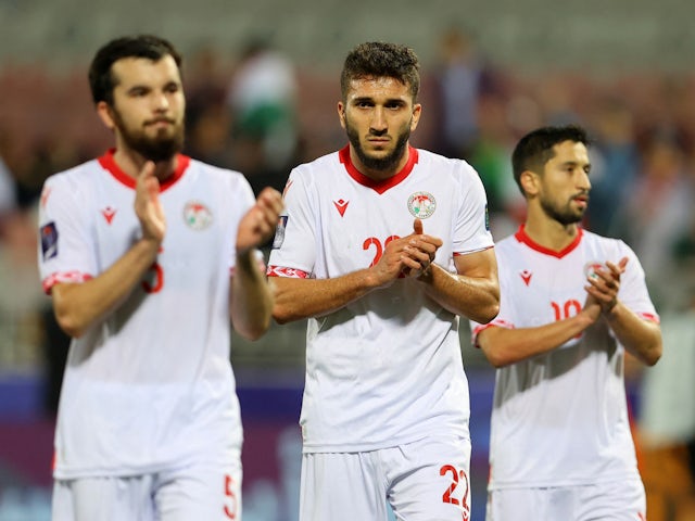 Tajikistan's Shahrom Samiev and teammates applaud their fans after the match on January 13, 2024