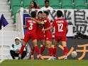Vietnam's Pham Tuan Hai celebrates scoring their second goal with Vo Minh Trong, Do Hung Dung and Phan Tuan Tai on January 14, 2024