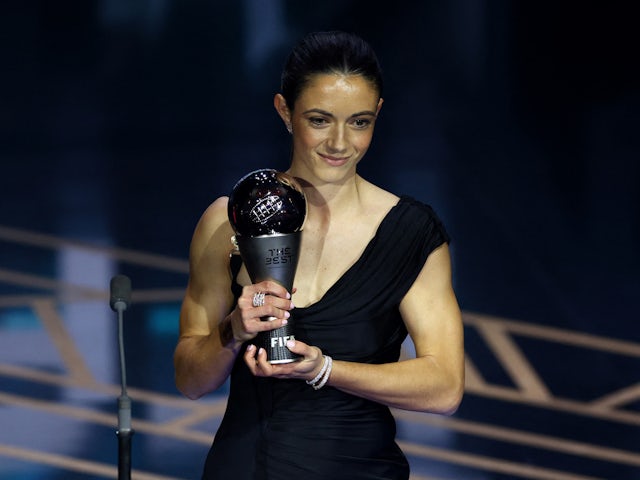 FC Barcelona's Aitana Bonmati holds a trophy on stage after winning the best women's player of 2023 during the awards ceremony on January 15, 2024