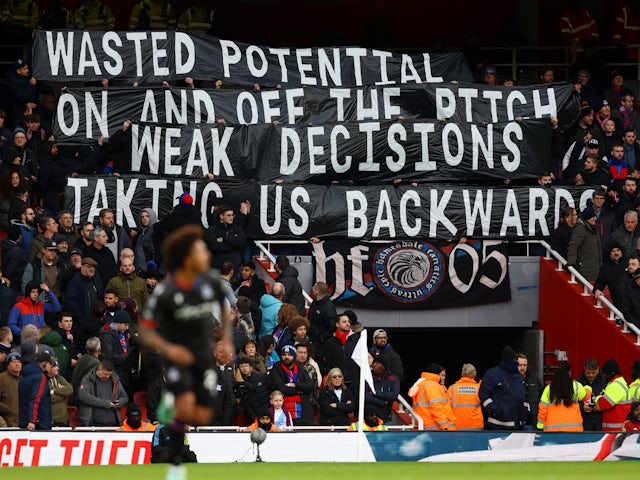 Crystal Palace fans display banners in the stands during the match on January 20, 2024