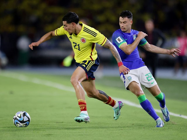 Colombia's Daniel Munoz in action with Brazil's Gabriel Martinelli on November 16, 2023