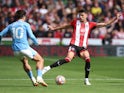 Manchester City's Jack Grealish in action with Sheffield United's Anel Ahmedhodzic on August 27, 2023