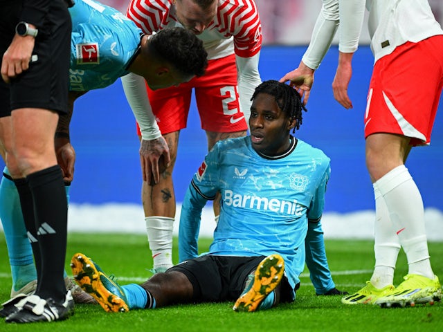 Bayer Leverkusen's Jeremie Frimpong reacts after sustaining an injury on January 20, 2024