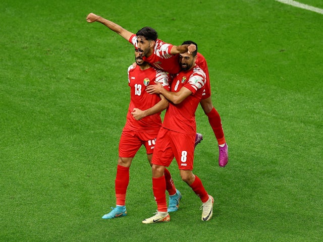 Jordan's Mahmoud Al Mardi celebrates scoring their third goal with Noor Al Rawabdeh and Yazan Al Naimat on January 15, 2024
