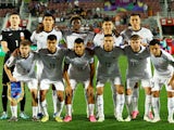 Kyrgyzstan players pose for a team group photo before the match on January 16, 2024