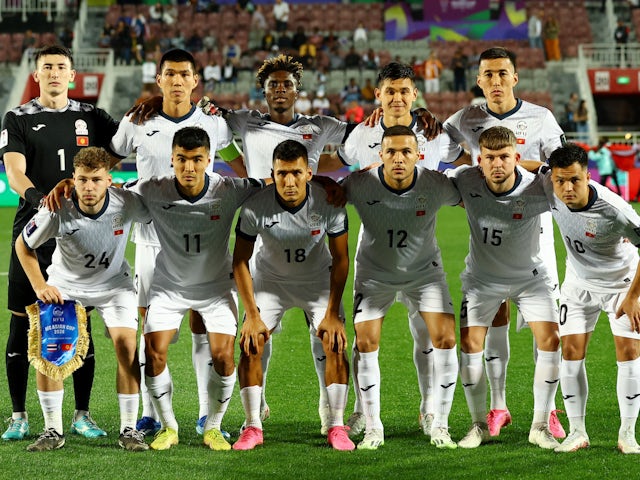 Kyrgyzstan players pose for a team group photo before the match on January 16, 2024