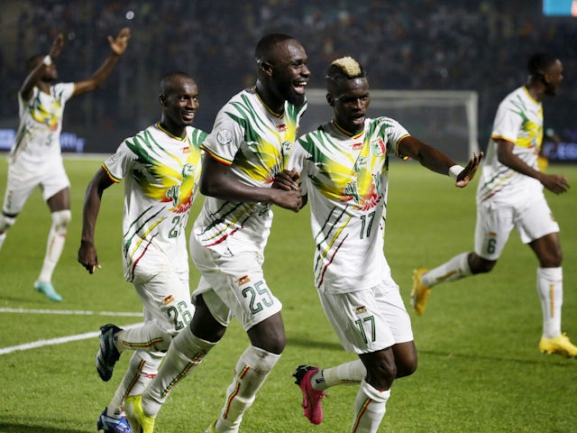 Mali's Lassine Sinayoko celebrates scoring their second goal with Falaye Sacko on January 16, 2024