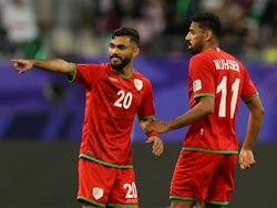 Oman's Salaah Al Yahyaei celebrates scoring their first goal with Muhsen Al Ghassani on January 16, 2024
