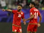 Oman's Salaah Al Yahyaei celebrates scoring their first goal with Muhsen Al Ghassani on January 16, 2024