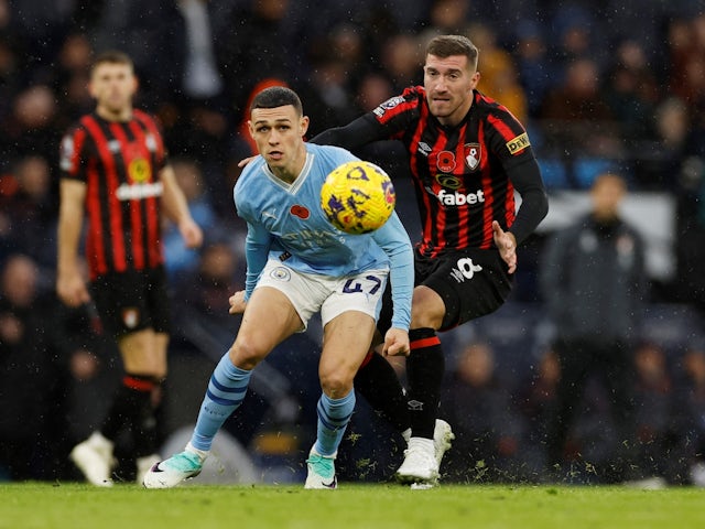 Manchester City's Phil Foden in action with AFC Bournemouth's Joe Rothwell on November 4, 2023