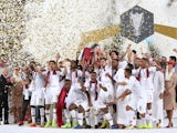 Qatar's Hasan Al Haydos lifts the trophy as they celebrate winning the Asian Cup in 2019