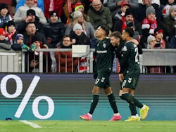 Werder Bremen's Mitchell Weiser celebrates scoring their first goal with Felix Agu and Justin Njinmah on January 21, 2024