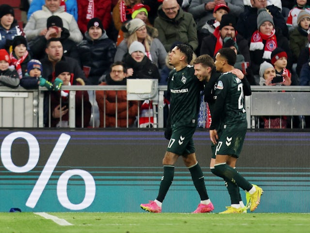 Werder Bremen's Mitchell Weiser celebrates scoring their first goal with Felix Agu and Justin Njinmah on January 21, 2024