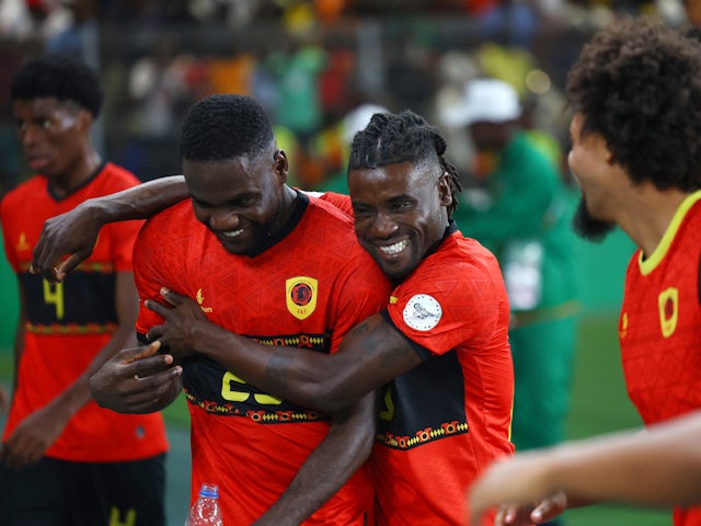 Angola's Show celebrates with teammates after the match on January 27, 2024