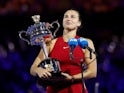 Aryna Sabalenka poses with the trophy after winning the Australian Open on January 26, 2024