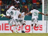 Cameroon's Karl Toko Ekambi celebrates scoring their first goal with teammates on January 23, 2024