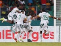 Cameroon's Karl Toko Ekambi celebrates scoring their first goal with teammates on January 23, 2024