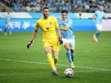 Atletico Madrid's Ivo Grbic in action with Manchester City's Julian Alvarez on July 30, 2023