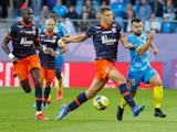 Montpellier's Maxime Esteve in action with RC Lens' Corentin Jean on October 17, 2021
