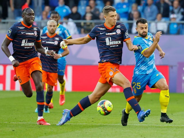 Montpellier's Maxime Esteve in action with RC Lens' Corentin Jean on October 17, 2021