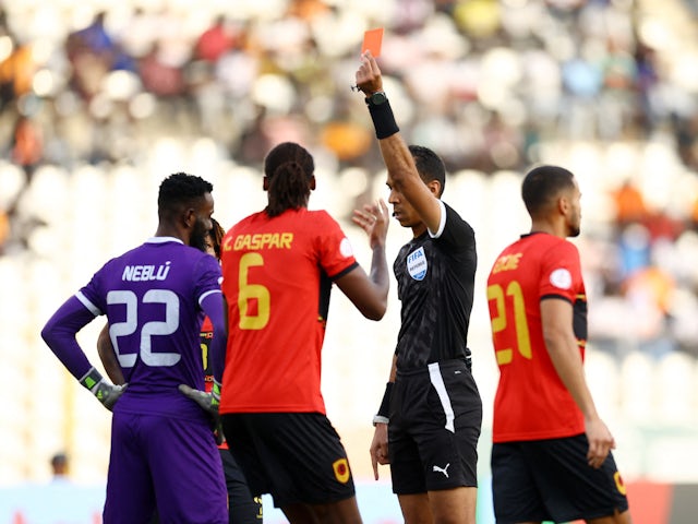 Angola's Neblu is shown a red card by referee Beida Damane on January 27, 2024