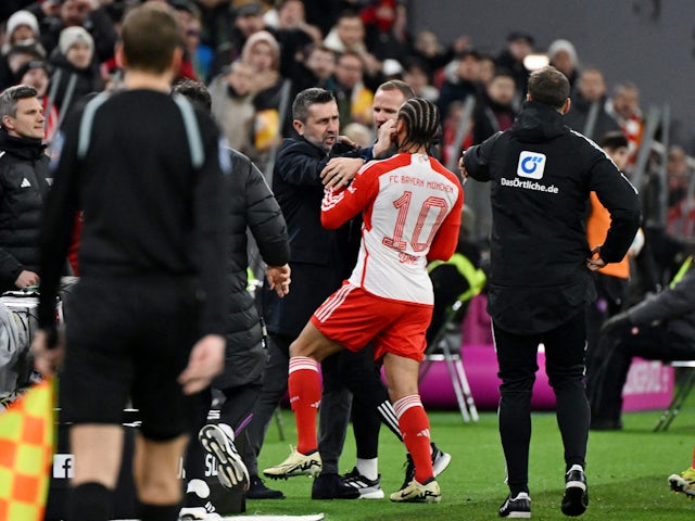 FC Union Berlin coach Nenad Bjelica clashes with Bayern Munich's Leroy Sane before being shown a red card by referee Frank Willenborg on January 24, 2024