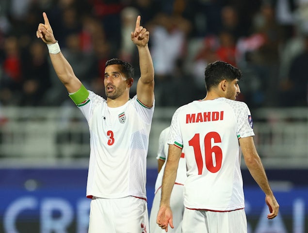 Ehsan Hajsafi  celebrates after scoring the decisive penalty for Iran against Syrian at the Asian Cup