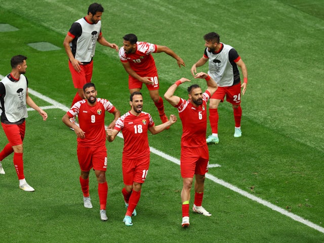 Yazan Al Arab celebrates his goal for Jordan against Iraq at the Asian Cup