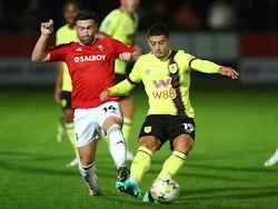 Burnley's Anass Zaroury in action with Salford City's Stevie Mallan on September 26, 2023