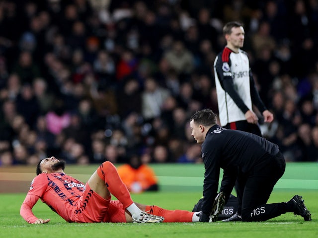 Everton's Arnaut Danjuma receives medical attention after sustaining an injury on January 30, 2024