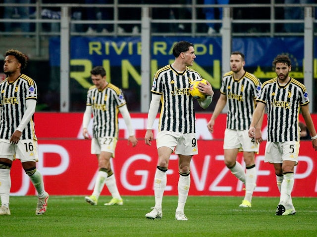 Juventus' Dusan Vlahovic and teammates look dejected after Federico Gatti scores an own goal on February 4, 2024