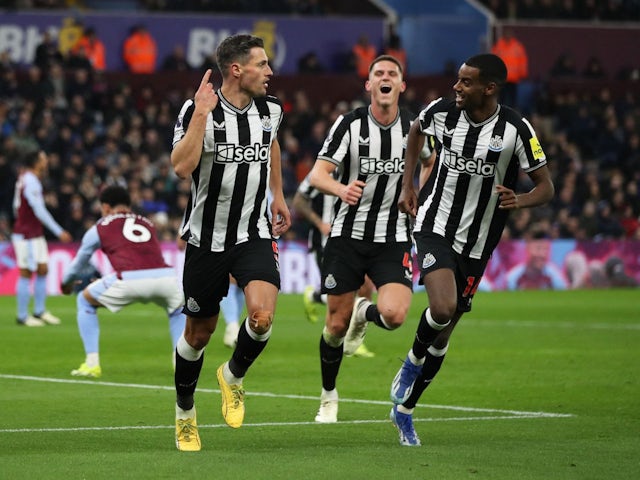 Newcastle United's Fabian Schar celebrates scoring their first goal with Alexander Isak on January 30, 2024