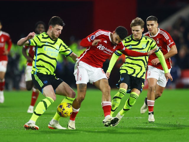 Nottingham Forest's Morgan Gibbs-White in action with Arsenal's Declan Rice and Martin Odegaard on January 30, 2024